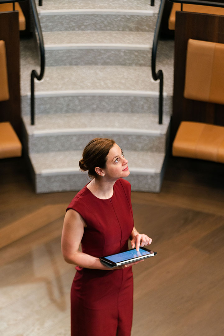 Person using a tablet in a lecture theatre